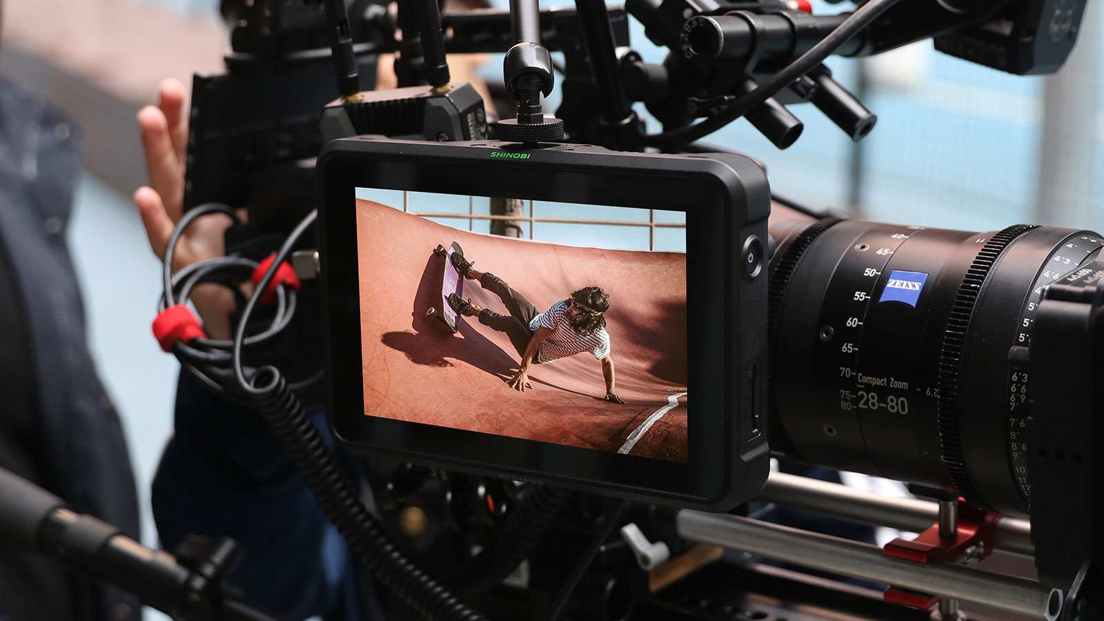 external camera screen showing a skateboarder on a half pipe