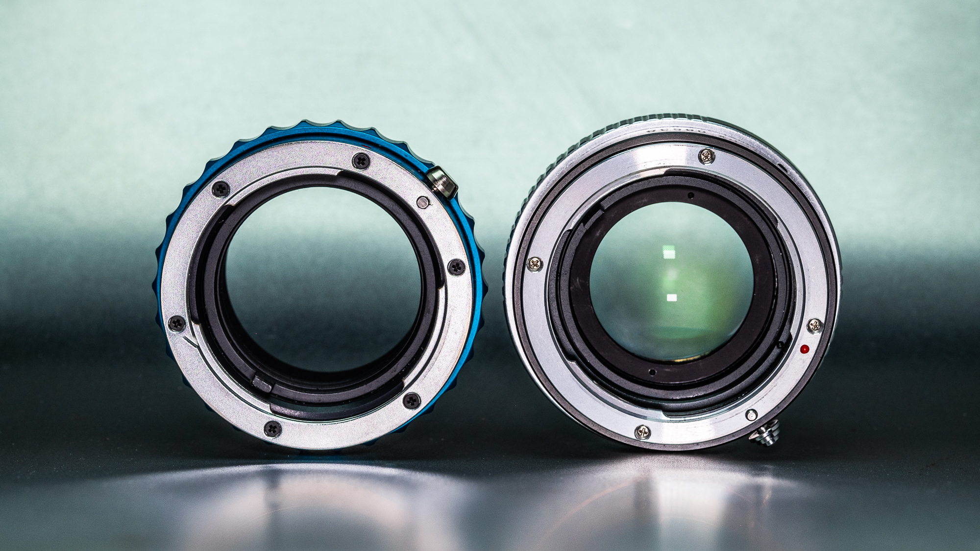 A standard adapter on the left and an optical adapter on the right