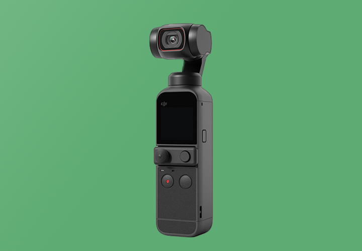 Product shot of the DJI Pocket 2 gimbal camera on a green background