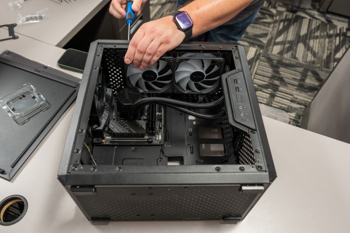 Installing the AIO Cooler fans at the top of the case Installing the AIO Cooler fans at the top of the case