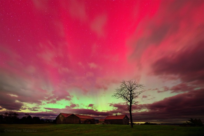 A bright display over some barns near Lake Champlain. Taken during a notable geomagnetic storm on October 10, 2024.