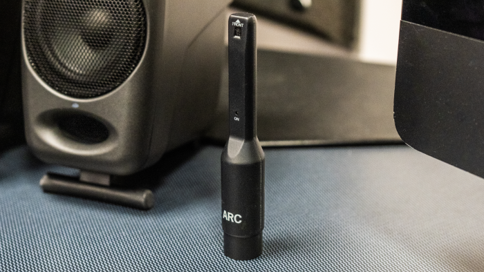 Small microphone standing on desk Small microphone standing on desk