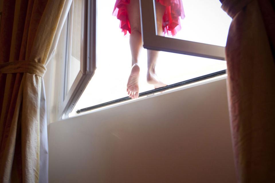 One of a few photos McClure made about physically leaving the narrative behind and finding an exit from the pattern. “There was a small patio right outside the window,” she says, “but I like that it looks like I’m stepping into the unknown.”