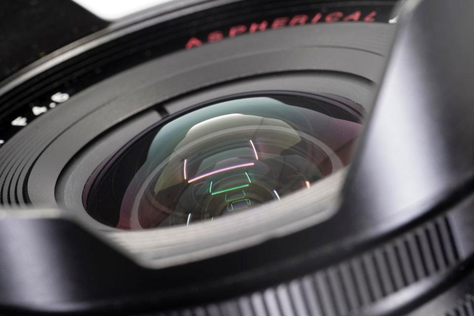 At wider apertures, curved-field lenses tend to be noticeably sharper at the center of the frame compared to the edges of the frame. If you want sharp edges, you must stop the lens down, which unless we are shooting under low light or want shallow depth of field is something we do regardless. The front elements of curved-field lenses are shaped more like a fishbowl compared to the flatter front elements on flat-field macro lenses.