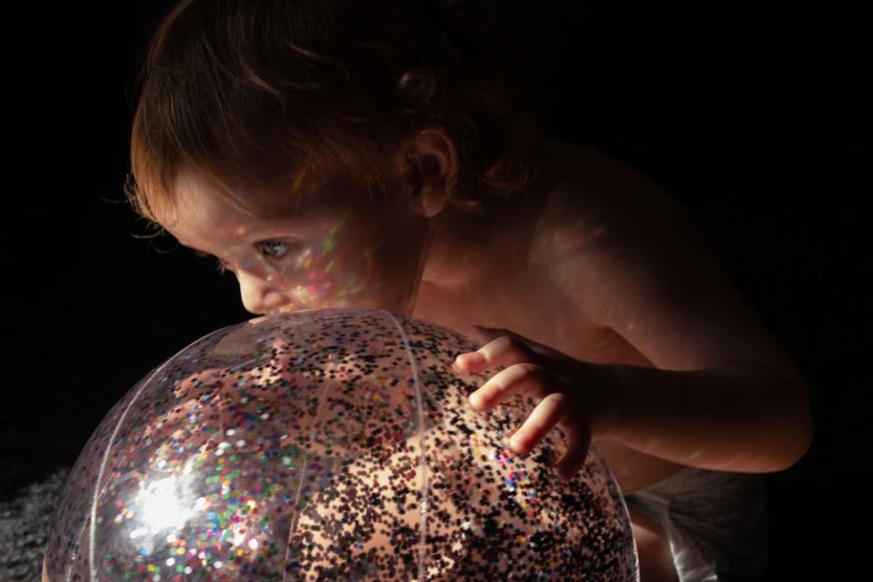 McClure’s daughter at play in her living room during the height of the pandemic. “We read, we sing, we dance, we look for magic,” says McClure. “She forces me to be present in spite of my worry.”