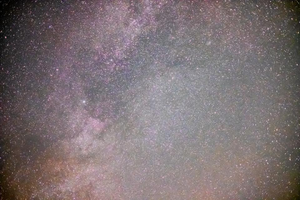 Deneb floats above the Earth in the night sky through a 35mm (50mm equivalent) lens.