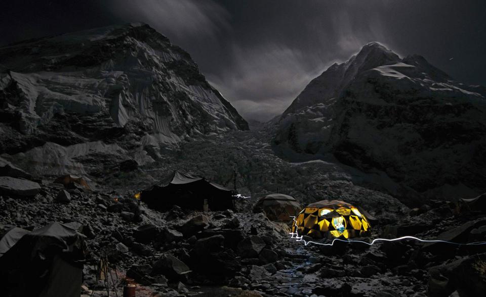 When Chow climbed Mount Everest in 2005, photography was merely a hobby. Pictured here, Everest base camp at night.