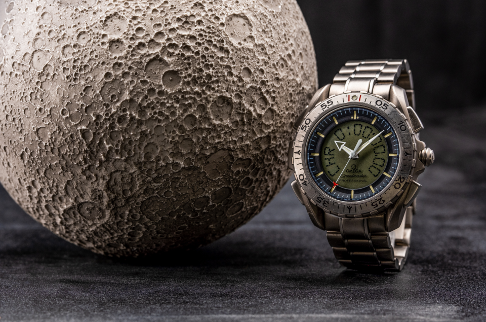The Omega Speedmaster Professional X-33 Ref 3291.50.00 and an AstroReality moon model.