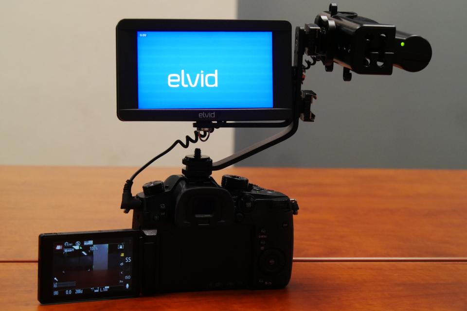 Monitor in articulating bracket with mic mounted sideways