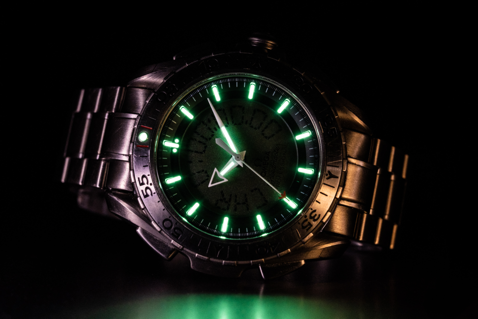The Omega Speedmaster Professional X-33 Ref 3291.50.00 has an anti-glare sapphire crystal and good lume, but sometimes a polarizing filter can cut down on reflections.