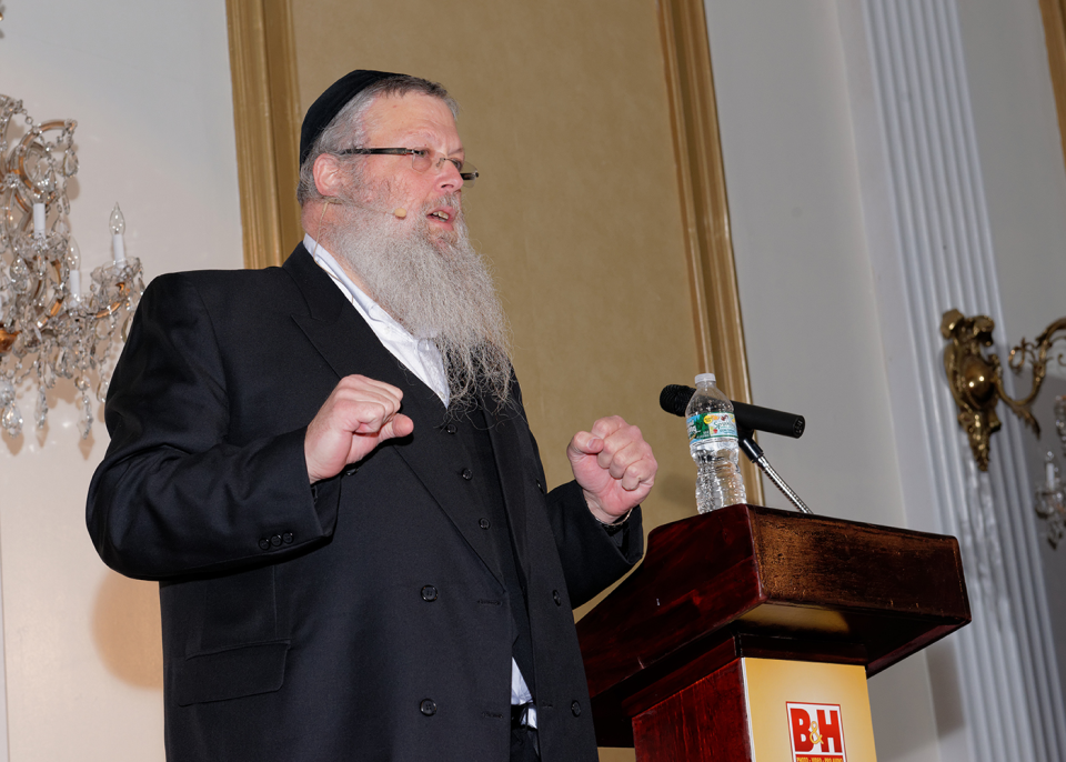 Yossi Fogel speaking to 400 people at a sales event in 2014 Yossi Fogel speaking to 400 people at a sales event in 2014
