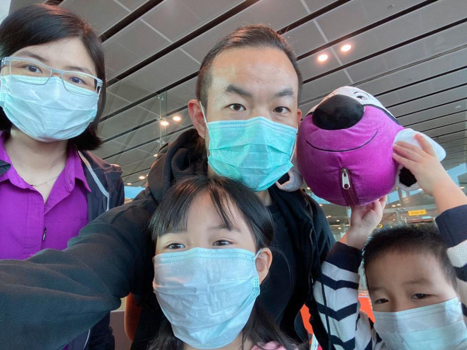 A selfie of Chow and his family in transit, the day they flew back to Beijing.