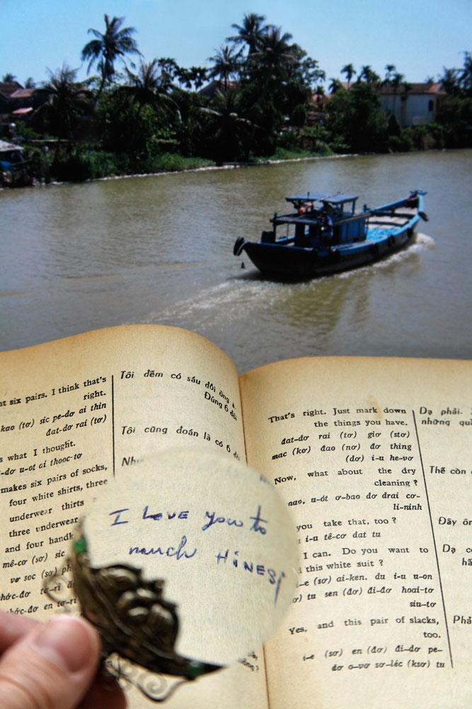 A tiny magnifying glass enlarges the handwritten note added to a page of her brother’s Vietnamese dictionary, evidence of a love story that will remain forever a mystery.&nbsp;&nbsp;