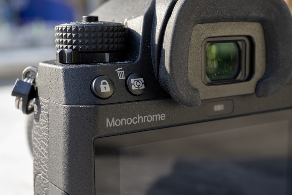 Besides the gray paint in the front Pentax logo and overall grey iconography, this “Monochrome” insignia on the back is the only indication of the camera being the black-and-white-only model.