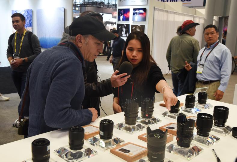 Jason and Allan record conversation with Viltrox representative at PhotoPlus 2019