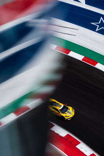 Reflections from the Circuit of the Americas tower railing give an interesting pop of color to the track with a bright yellow Corvette flashing past underneath, Austin, Texas. Nikon D5, ISO 320, 100 mm f/4 lens at 1/2500, Exposure compensation: -0.3.