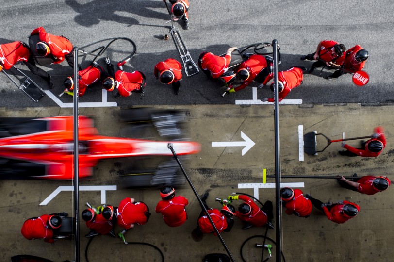 Pitstop practice is a ballet for mechanics in fire suits Everyone has a job to do and it’s fascinating to watch it unfold. Nikon D3s, ISO 100, 28 mm f/22 lens at 1/15, Exposure compensation: -0.7.