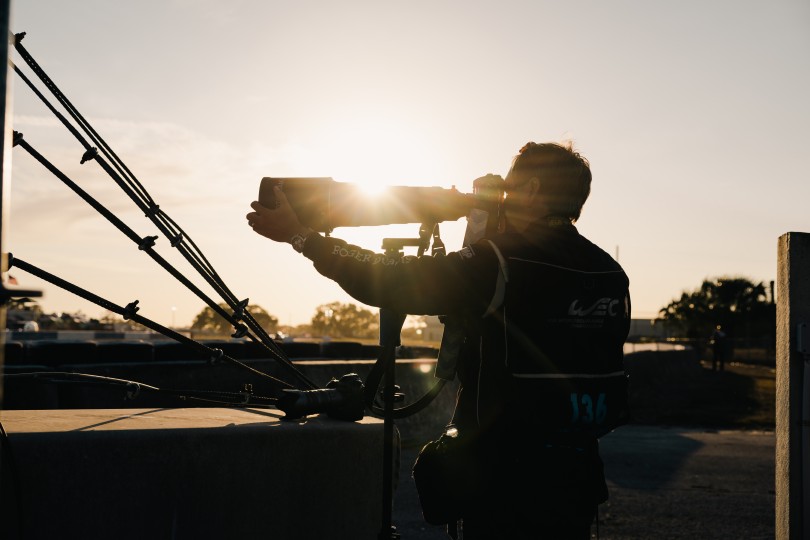 Jamey Price setting up a super telephoto shot near sunset, IMSA 12-hours of Sebring race, photo © Lenssen Photo.