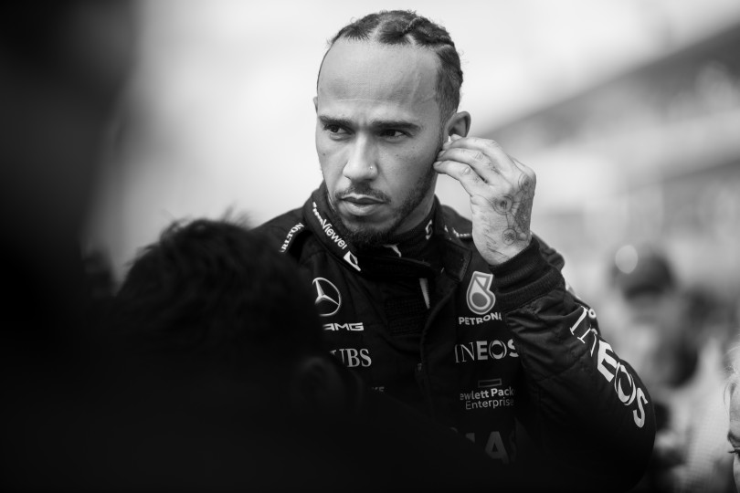 Seven-time world champion Lewis Hamilton prepare for battle before an F1 race. In addition to capturing peak action on the track, motorsport photographers are busy capturing candid moments. Nikon D6, ISO 100, 200 mm f/2.8 lens at 1/800, Exposure compensation: 0.3.