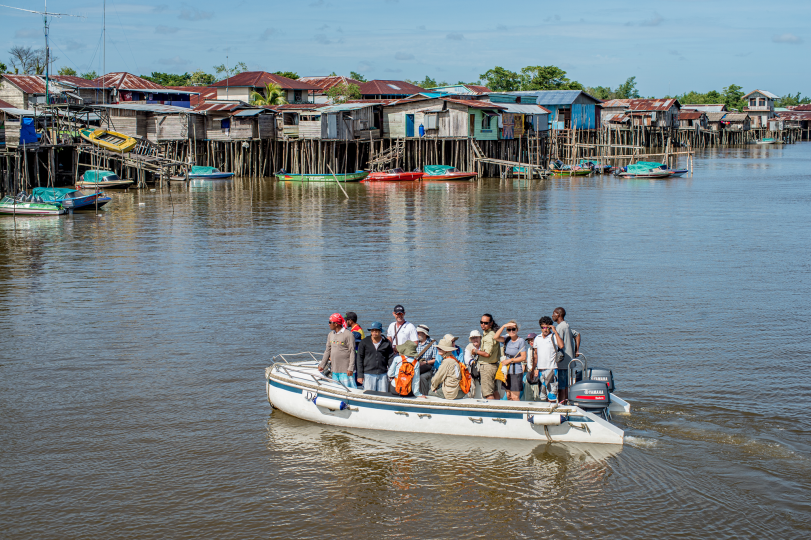 During an excursion to Asmat, western tourists circle the city of Agats and return to their ship within two hours, 5/16/15. 