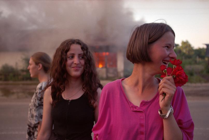 Two Girls Greeting Soldiers in Kosovo © Alexandra Boulat. Reproduced by permission from Association Pierre & Alexandra Boulat