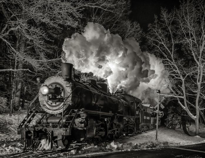 The Valley Railroad’s 2-8-2 Mikado bursts through the night and snow in Essex Connecticut, 2017 © Dennis A. Livesey