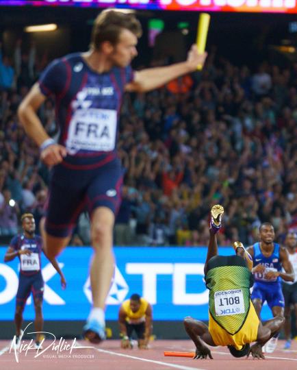 Usain Bolt stumbles and falls during race © Nick Didlick