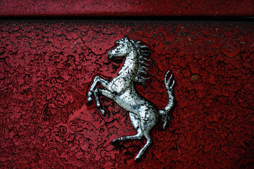 Road grime, exhaust, and brake dust stick to the back of a Ferrari after a Le Mans test session. Nikon D3, ISO 400, 200 mm f/2.8 lens at 1/320.