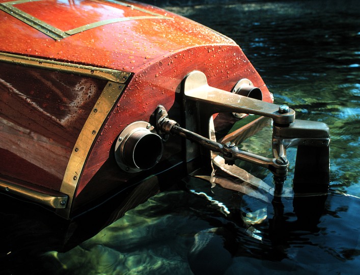 Original Source: Working with photographs from his personal library, Weitz cherry-picked images featuring color palates, textures, and forms to serve as the ‘DNA’ of prompt-inspired AI camera illustrations. The starting point for his first imaginary camera is the steering system of a 1930s Hackercraft mahogany runabout. © Allan Weitz