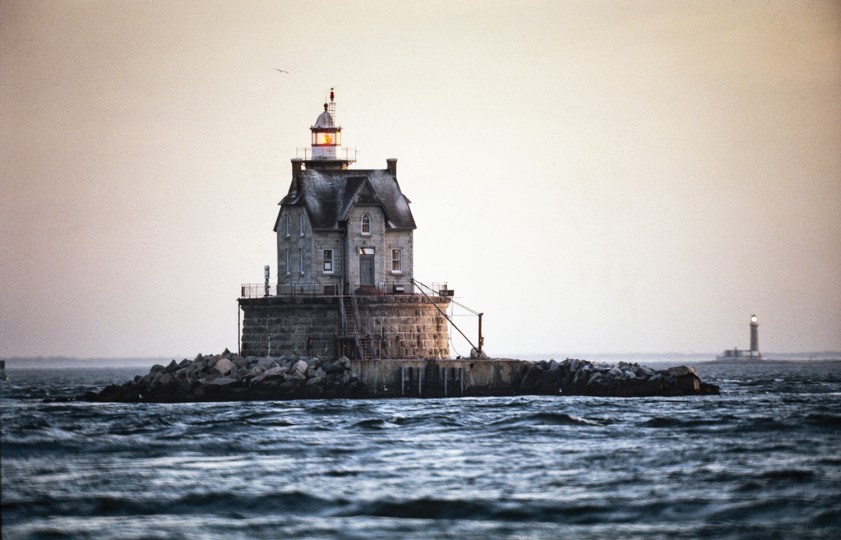 Original Source: Weitz used a sunset photograph of a lighthouse as source for more than a dozen interpretations featuring cameras floating on water or riding waves. © Allan Weitz