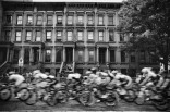 Spectators watch cyclists racing at the Harlem Criterium by Marcus Garvey Park, New York City, 6/21/15. Leica M (Typ 240), Leica Summilux-M 24mm ASPH, 1:1.4.
