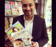 Enrique at the newsstand with fashion magazines.