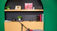 Built-in shelving adjacent to the set for display of books and other items from upcoming guests.