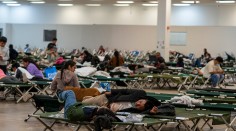 Migrants resting on cots while in temporary shelter at Casa Alitas, Tucson, AZ.