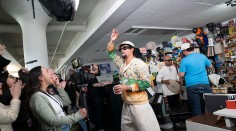 NPR staff videographer Keren Carrion cheers for Bad Bunny during his NPR Tiny Desk Concert, November 2025.