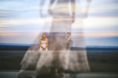 An in-camera triple exposure, created partly by accident. Hurd intended to make a double exposure, but the camera was set to make three exposures—one of the couple in the distance, and two of the bride walking in the foreground.