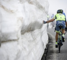 A Tinkoff rider couldn't resist getting a feel of the snow up the misty Colle dell'Agnello during stage 19 of the 99th Giro d'Italia, 2016. Nikon D4s, AF-S Zoom-Nikkor 70-200mm, f/2.8G ED VR II