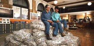 Jay Masiel & Stephen Wilkes atop bags of transparencies in the first floor of Jay’s legendary bank building, NYC.