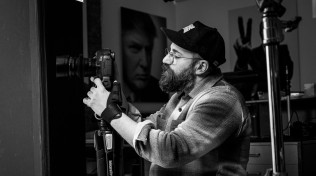 Behind the scenes view of Alex operating his B-Cam on-set for an interview with John Lithgow, February 2025