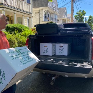 Gerald Freyer of Film Rescue Intl. loading truck with boxes of film, Somerville, MA