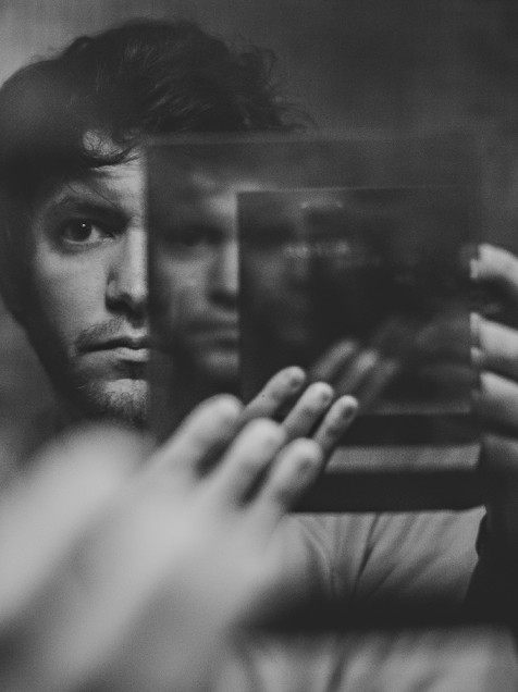 Self-portrait of Sam Hurd made by shooting through an oversized one-way mirror, held in front of the camera while shooting into another normal mirror.