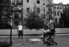 Malik shoots some hoops from his wheelchair. Typically, his only exercise is a daily pushup regime in bed.