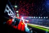 Various color temperatures from multiple light sources provide a wild array of colors during heavy rainfall in the Daytona pitlane. Nikon D5, ISO 640, 35 mm f/1.4 lens at 1/250.