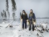 Andrew Dallas Blackstone (left) and Gene Williamson had to stop work during a rare summer snow, because they couldn’t see the seedlings. As soon as it melts, they’ll recommence.