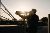 Jamey Price setting up a super telephoto shot near sunset, IMSA 12-hours of Sebring race, photo © Lenssen Photo.