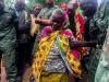 A woman cries over the grave of Léopold Ngbekusa during the funeral of the Okapi Wildlife Reserve rangers, outside of the town of Epulu, in the Democratic Republic of Congo, July 17, 2017. © Adriane Ohanesian
