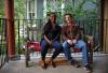 Southside, Englewood resident Nanette sitting with her “map twin” Wade, on his porch in Chicago’s northside neighborhood of Edgewater, from “Folded Map Project” © Tonika L. Johnson