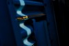 Early morning light accentuates the guard rail and frames a Corvette C7.R during a short warm up session for the 2018 Watkins Glen 6-hour race. Nikon D3, ISO 200, 80 mm f/8 lens at 1/1000.