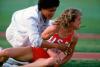 Mary Decker looks on in pain after colliding with Zola Budd and falling during the 3000-meter race at the 1984 Olympics, in Los Angeles © 2020 David Burnett/Contact Press Images