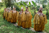 Dat spirit masks, representing an ancestor or deceased family member, emerge from the jungle during the Jipae resurrection feast in the village of Kapi, 7/23/15. 